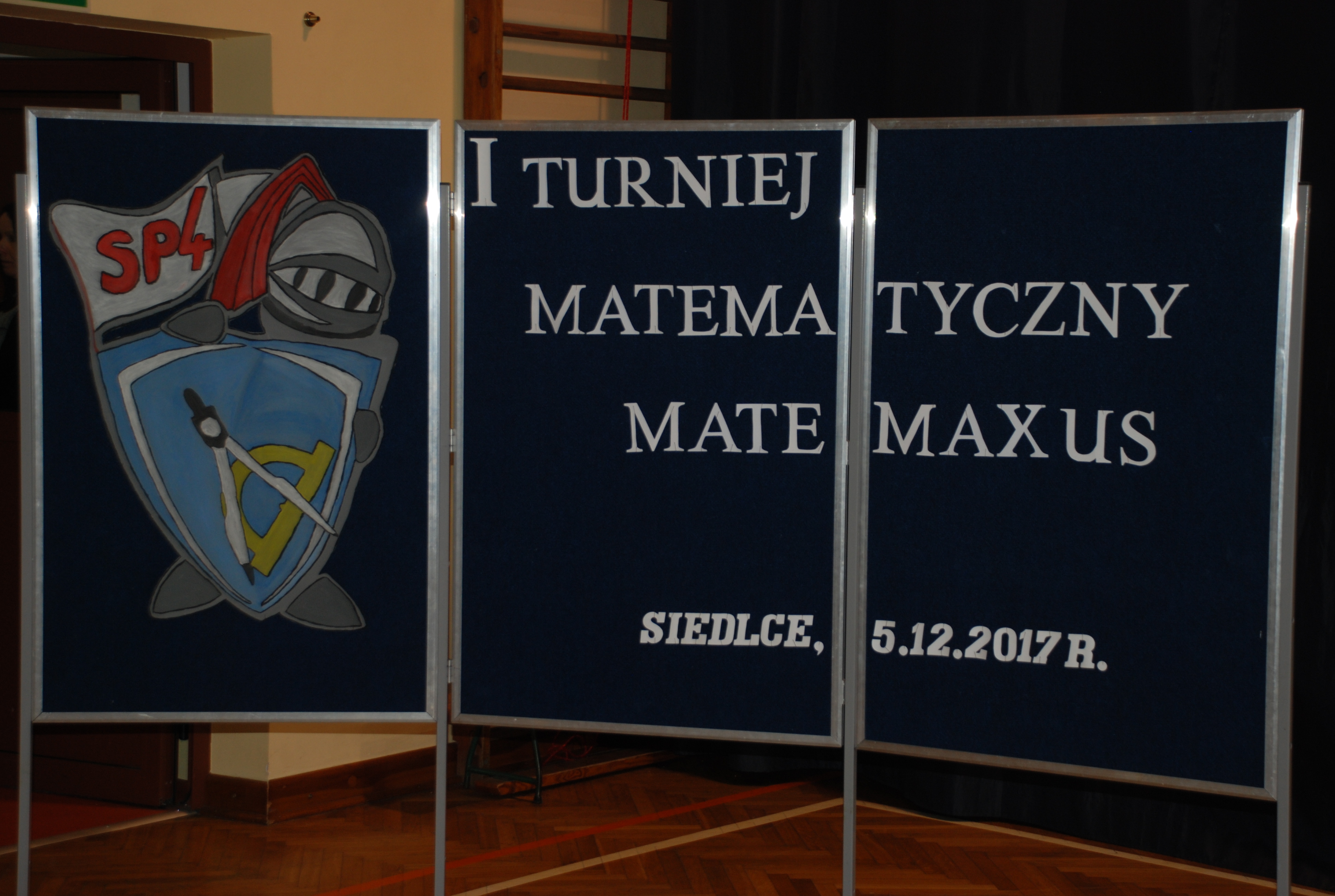 zdjęcie plakatu konkursu z napisem - I Turniej matematyczny Matemaxus, Siedlce, 5.12.2017r.